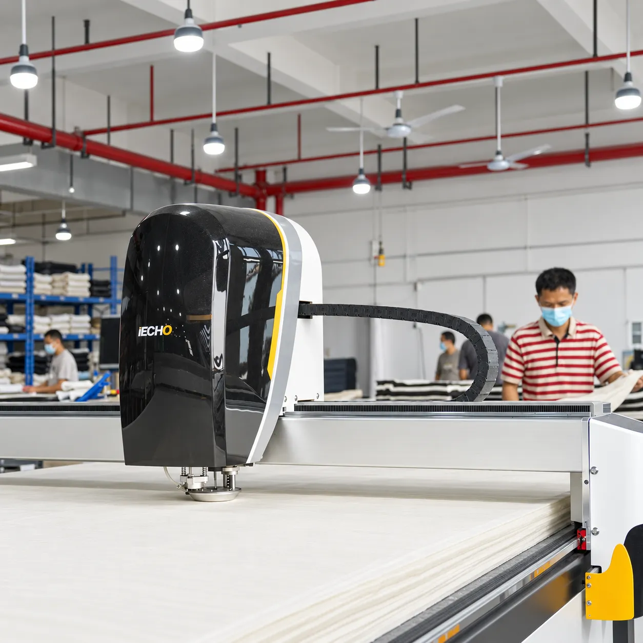 Automated garment cutting table in an apparel factory
