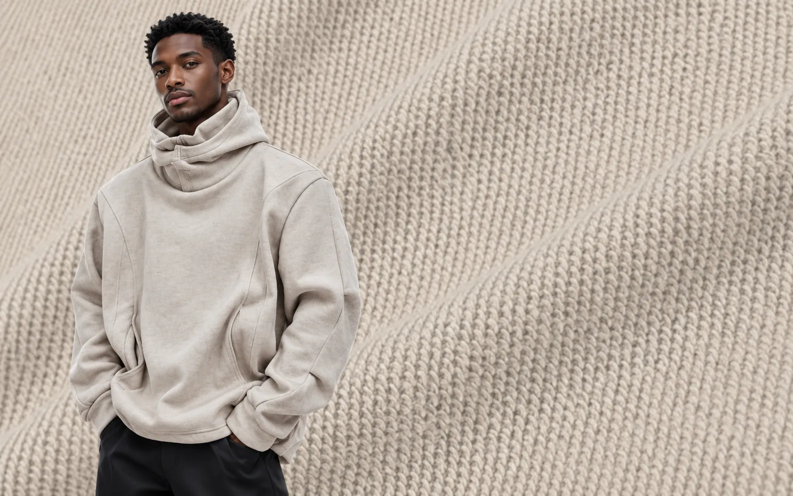 Light neutral high-neck hoodie with a relaxed silhouette and shaped seam details